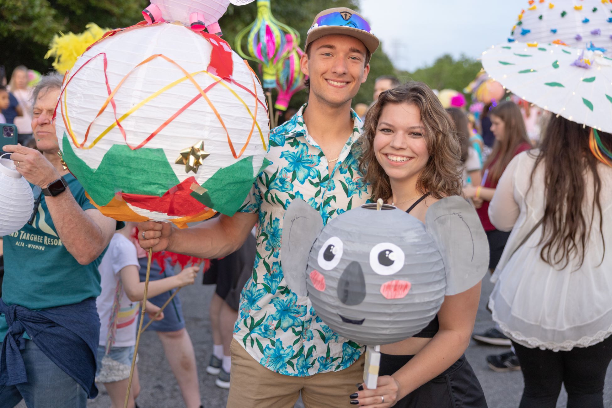 Two participants hold up their handmade lanterns 